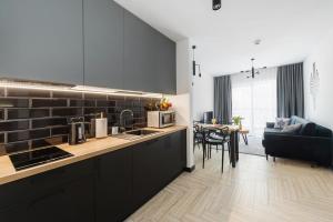 Kuchyňa alebo kuchynka v ubytovaní Apartament - Kluszkowce nad Jeziorem Czorsztyńskim