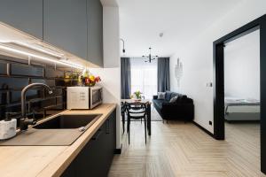 Kuchyňa alebo kuchynka v ubytovaní Apartament - Kluszkowce nad Jeziorem Czorsztyńskim