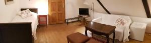 Posteľ alebo postele v izbe v ubytovaní Apartmány U sv. Floriána