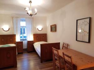 Posteľ alebo postele v izbe v ubytovaní Apartmány U sv. Floriána