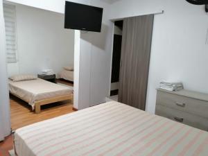 Postel nebo postele na pokoji v ubytování Hotel 42 Avenida