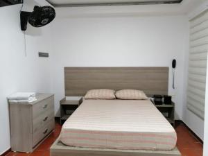 Postel nebo postele na pokoji v ubytování Hotel 42 Avenida