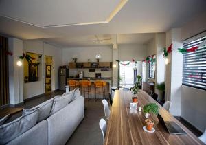 a living room with a couch and a table at Colmena Hotel CDMX Tonala in Mexico City