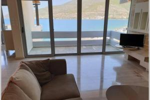 A television and/or entertainment centre at Penthouse -Breathtaking sea view-Just on the beach