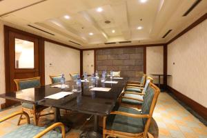 a conference room with a long table and chairs at Wei-Yat Grand Hotel in Anping
