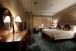 Postel nebo postele na pokoji v ubytování Hotel Allamanda Aoyama Tokyo