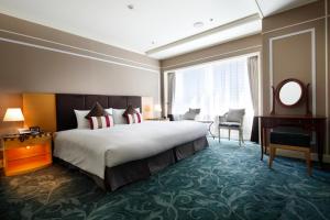 Postel nebo postele na pokoji v ubytování Hotel Allamanda Aoyama Tokyo