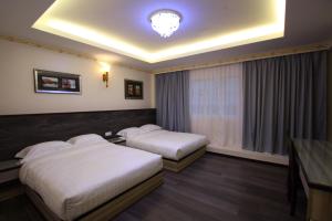 Postel nebo postele na pokoji v ubytování Shamrock Guest House