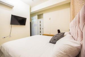Postel nebo postele na pokoji v ubytování Square B&B
