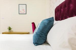 Postel nebo postele na pokoji v ubytování Square B&B