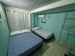 A bed or beds in a room at Apartamentos Sound Bay Beach