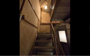 a staircase in a building with a stair case at The Barefoot At Havelock in Havelock Island
