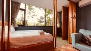 Voodi või voodid majutusasutuse Yue Lake Backpackers toas