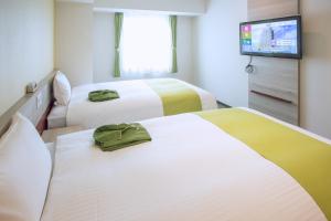 Postel nebo postele na pokoji v ubytování Kuretake Inn Premium Meieki minami