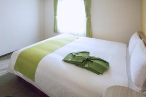 Postel nebo postele na pokoji v ubytování Kuretake Inn Premium Meieki minami