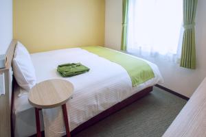 Postel nebo postele na pokoji v ubytování Kuretake Inn Premium Meieki minami