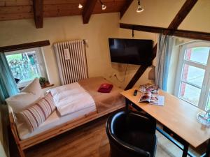 Ein Bett oder Betten in einem Zimmer der Unterkunft Zur Goldenen Kartoffel