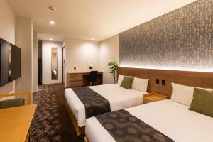 TV a/nebo společenská místnost v ubytování Chiyokura HOTEL SHUKU Nagoya