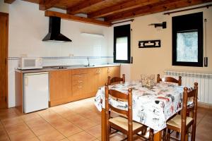 Kuchyň nebo kuchyňský kout v ubytování Apartaments Beta