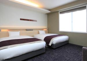 Postel nebo postele na pokoji v ubytování Urban Hotel Kyoto Shijo Premium