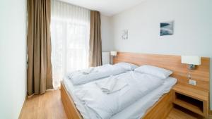 Posteľ alebo postele v izbe v ubytovaní Apartamenty Sun & Snow Resort Karkonosze