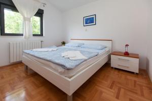Posteľ alebo postele v izbe v ubytovaní ALANA 1 PENTHOUSE