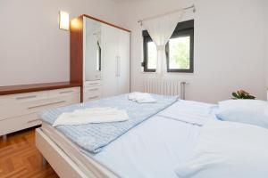 Posteľ alebo postele v izbe v ubytovaní ALANA 1 PENTHOUSE