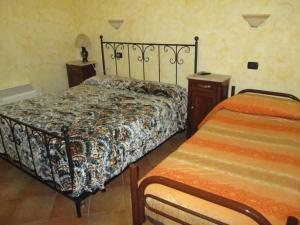 Postel nebo postele na pokoji v ubytování Agriturismo Il Vecchio Carro
