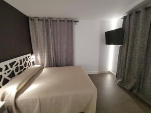 Postel nebo postele na pokoji v ubytování VILLA MAREL