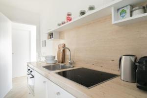 A kitchen or kitchenette at Amazing Penthouse Piazza Venezia