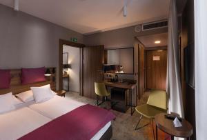 Postel nebo postele na pokoji v ubytování Hotel Sadova