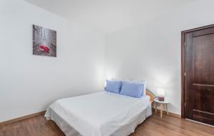Ein Bett oder Betten in einem Zimmer der Unterkunft Apartments Spinotti