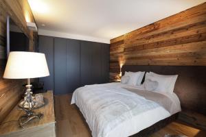 Giường trong phòng chung tại Petit Chalet Blanc Cervinia +7 ảnh