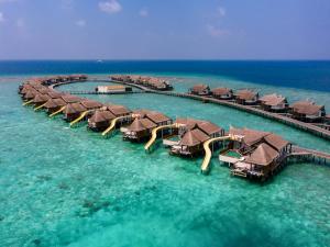 an aerial view of overwater bungalows in the ocean at OZEN RESERVE BOLIFUSHI - Luxury All Inclusive in Male City