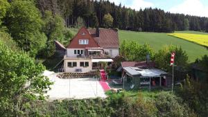 an aerial view of a house in a field at Haus Sonnenberg in Willingen