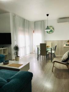 a living room with a couch and a table at Apartamento Llimera Altea in Altea