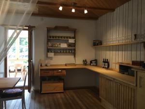 a kitchen with a counter and a table in a room at Centro Arte Cabbiolo in Cabbiolo