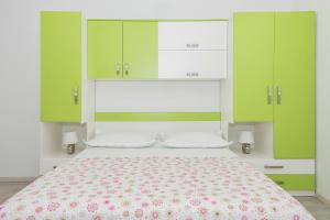 Postel nebo postele na pokoji v ubytování Apartmani Katarina