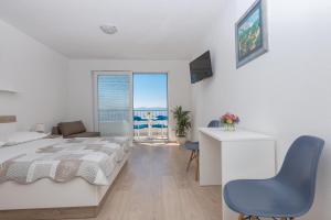 Postel nebo postele na pokoji v ubytování Apartmani Katarina