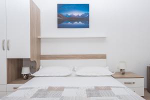 Postel nebo postele na pokoji v ubytování Apartmani Katarina