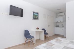 Kuchyň nebo kuchyňský kout v ubytování Apartmani Katarina