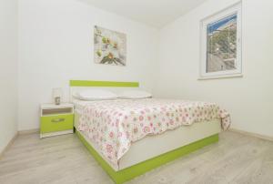 Postel nebo postele na pokoji v ubytování Apartmani Katarina