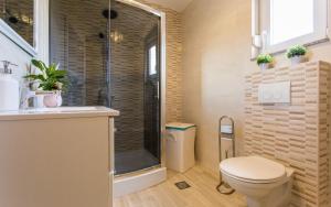 a bathroom with a toilet and a shower at Apartment Lana in Šilo