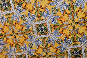 a yellow and blue pattern on a wall at La Casa Mata Central in Málaga