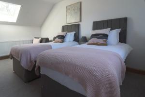 מיטה או מיטות בחדר ב-The Hayloft