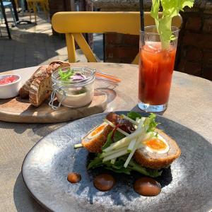 a sandwich and a drink on a table at Tower Hotel in Lincoln