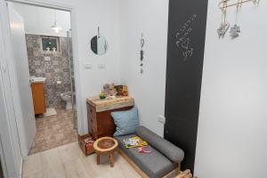 a living room with a couch and a bathroom at Ay La in El-Rom +72 photos