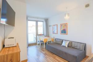 Un televizor și/sau centru de divertisment la Apartamenty Świnoujście - Kwartał Róży Wiatrów II