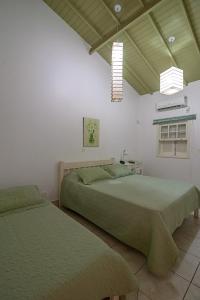 เตียงในห้องที่ Villa do Conde