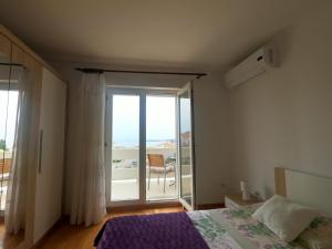 Posteľ alebo postele v izbe v ubytovaní Rooms Jelena
